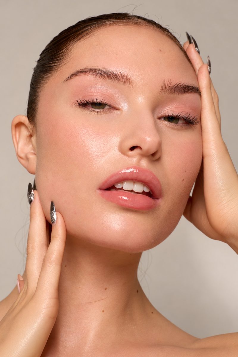 Dewy glowing skin, soft pink eyes and a glossy nude lip