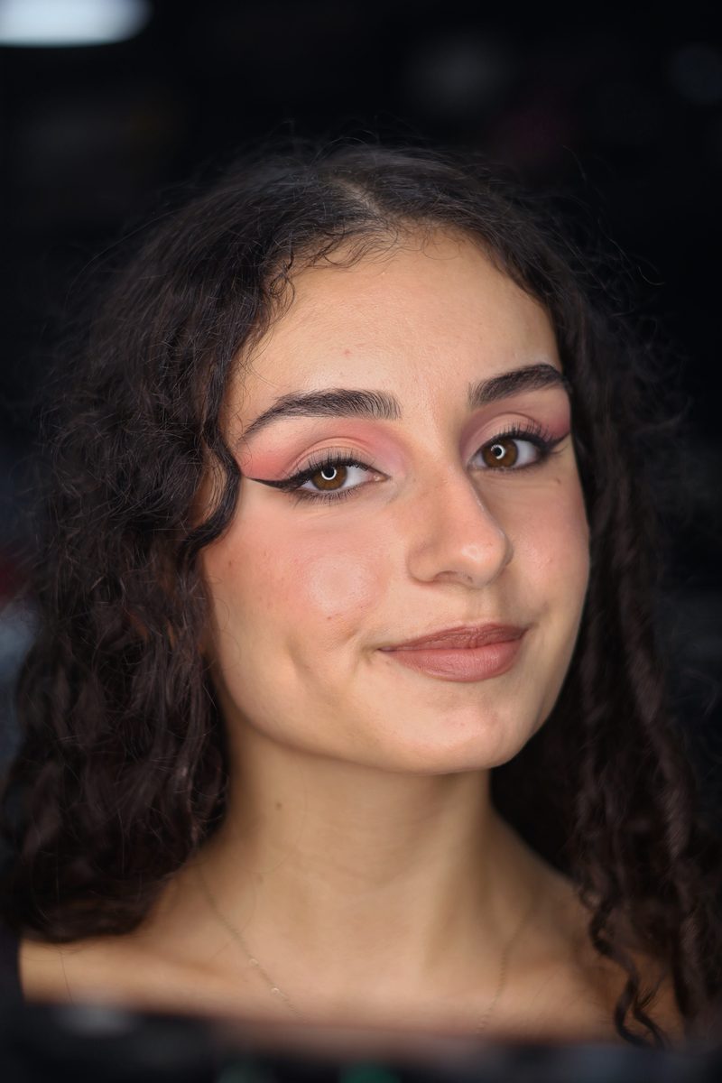 Rose pink eyeshadow with a sharp winged liner and nude lip, London makeup
