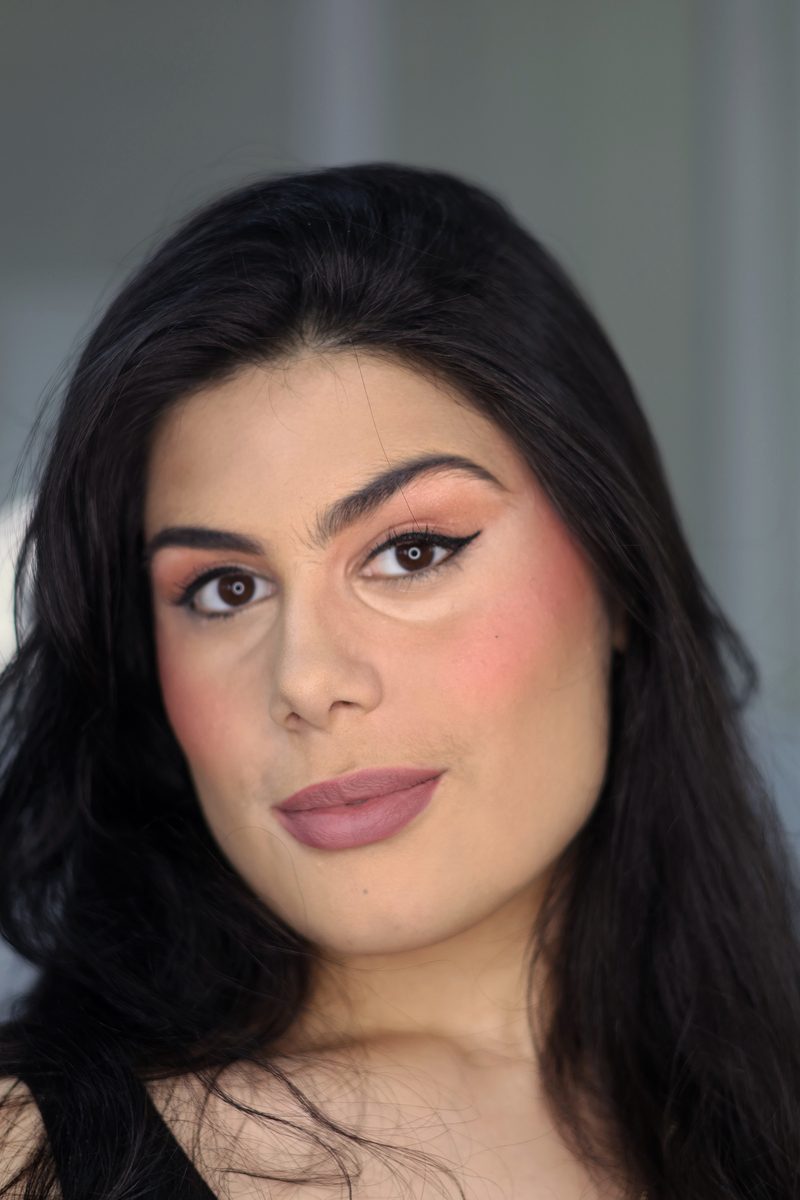 Soft glam with winged liner, warm blush and a mauve lip